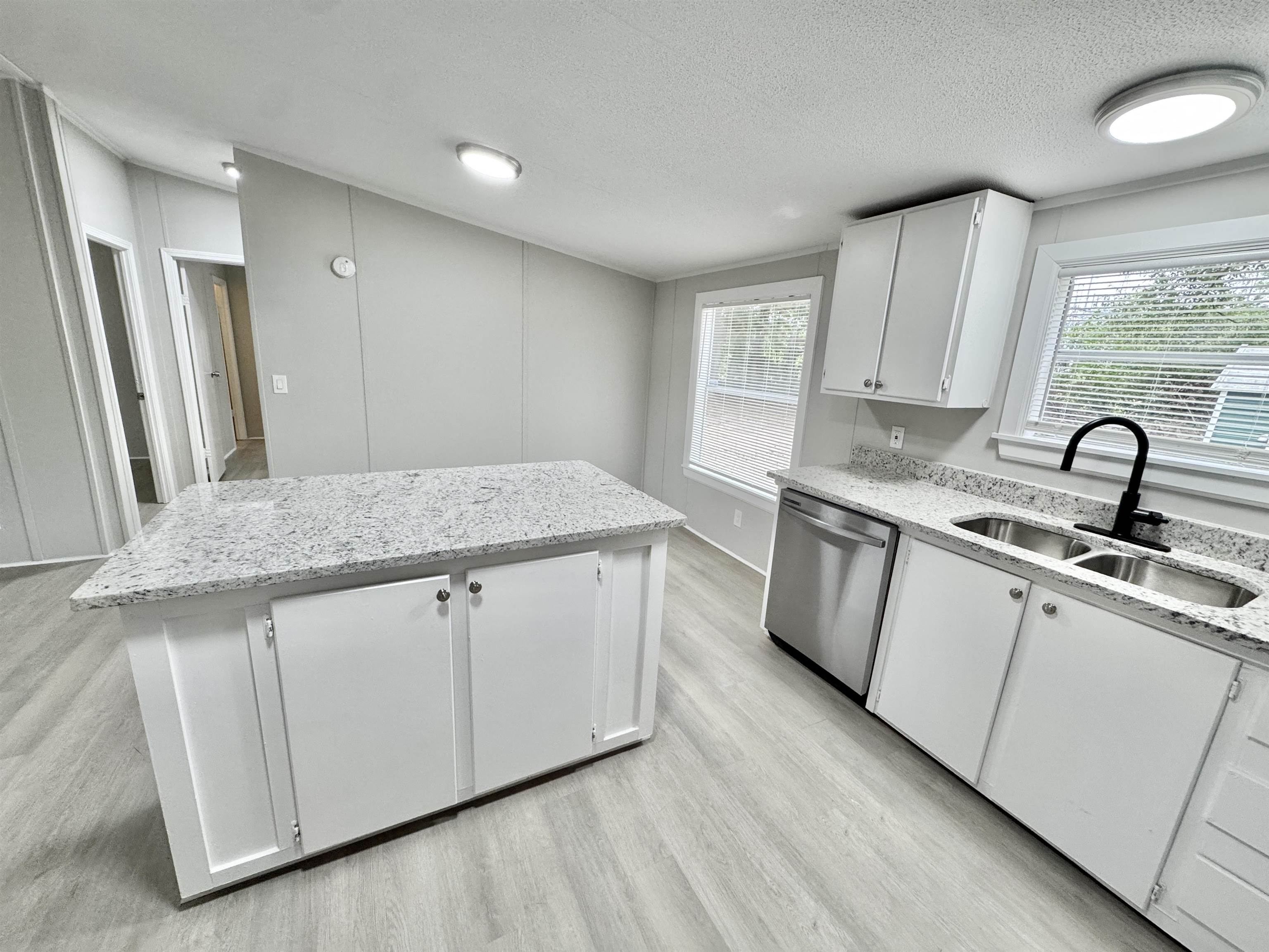 3178 Portersville Road Atoka, TN 38004 - Photo 7 of 31 a kitchen with stainless steel appliances granite countertop a sink stove and cabinets
