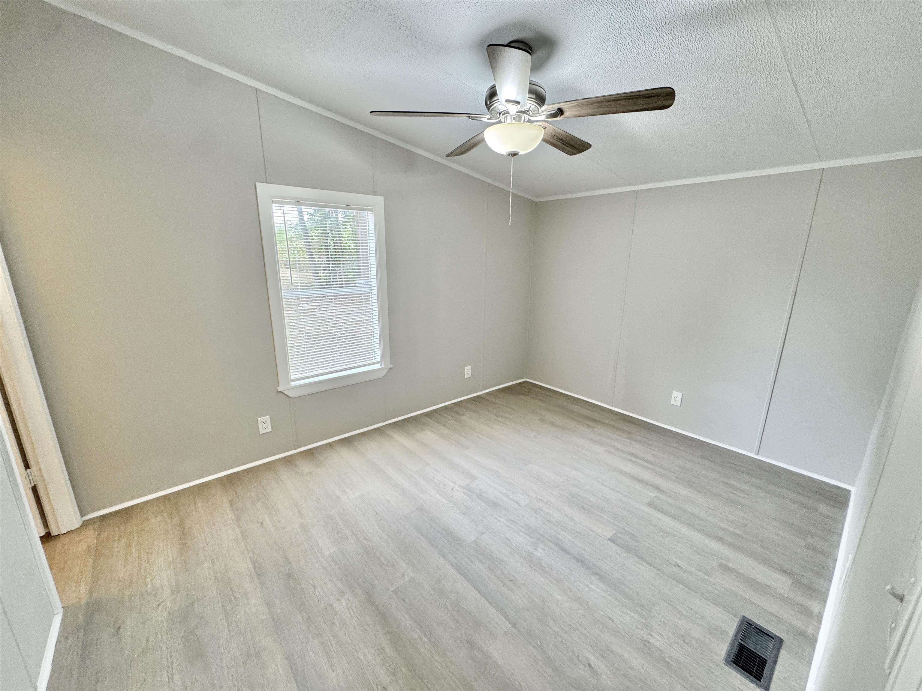 3178 Portersville Road Atoka, TN 38004 - Photo 10 of 31 wooden floor in an empty room with a window