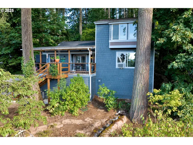 a view of a house with pool and garden