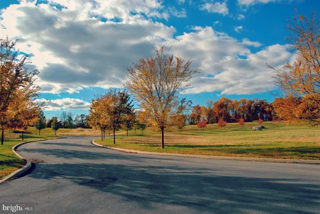 a view of swimming pool with an outdoor space and seating area