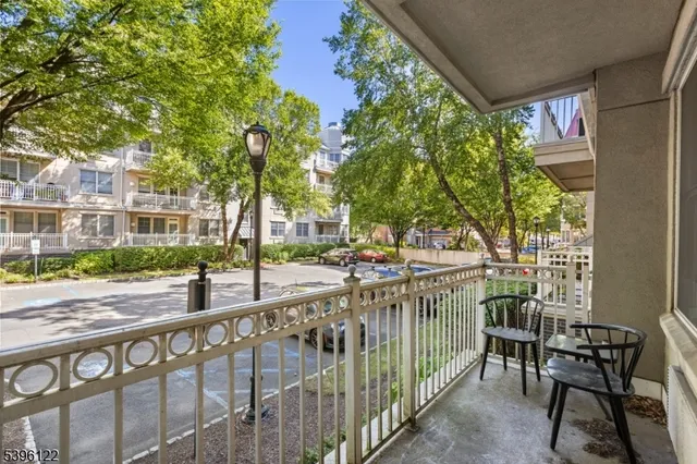 a view of a patio with table and chairs and potted plants