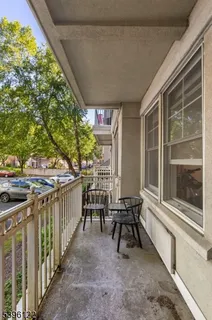 a view of two chairs in balcony