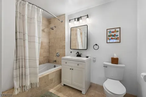 a bathroom with a toilet a sink and a bathtub