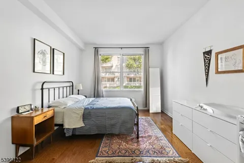 a bed room with a bed and a window