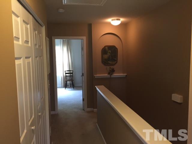 2838 Casona Way Raleigh, NC 27616 - Photo 14 of 20 a bathroom with a light fixture and a sink