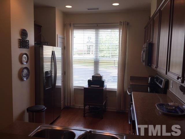 2838 Casona Way Raleigh, NC 27616 - Photo 8 of 20 a room with furniture and a window