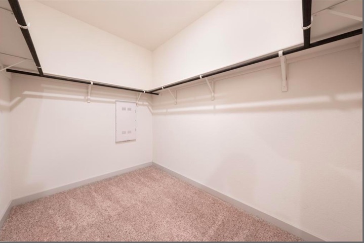 10805 Meris Lane Austin, TX 78754 - Photo 21 of 28 A well-organized closet offers ample storage with sturdy shelving and hanging rods.
