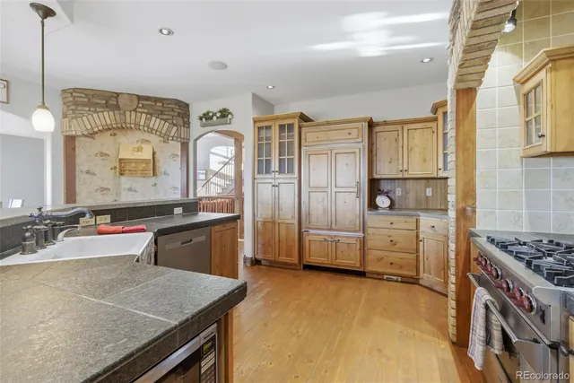 a kitchen with cabinets and window