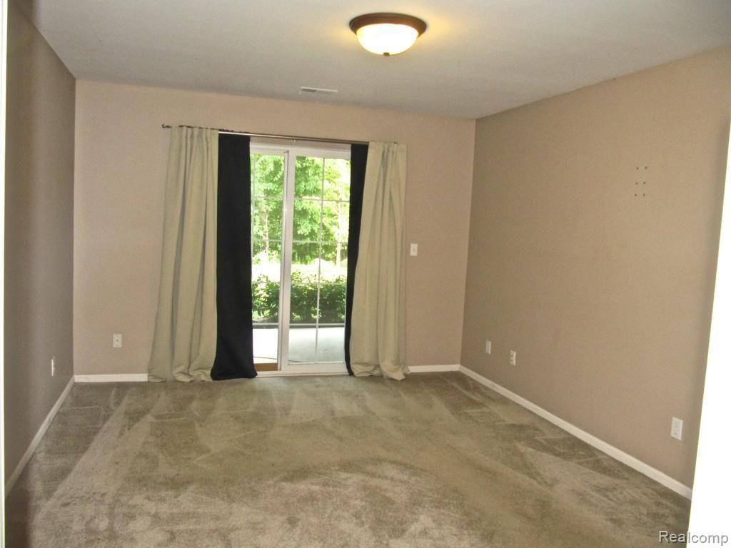 3397 Tremonte Circle, Unit 202 Rochester, MI 48306 - Photo 25 of 35 Master Suite opens to patio