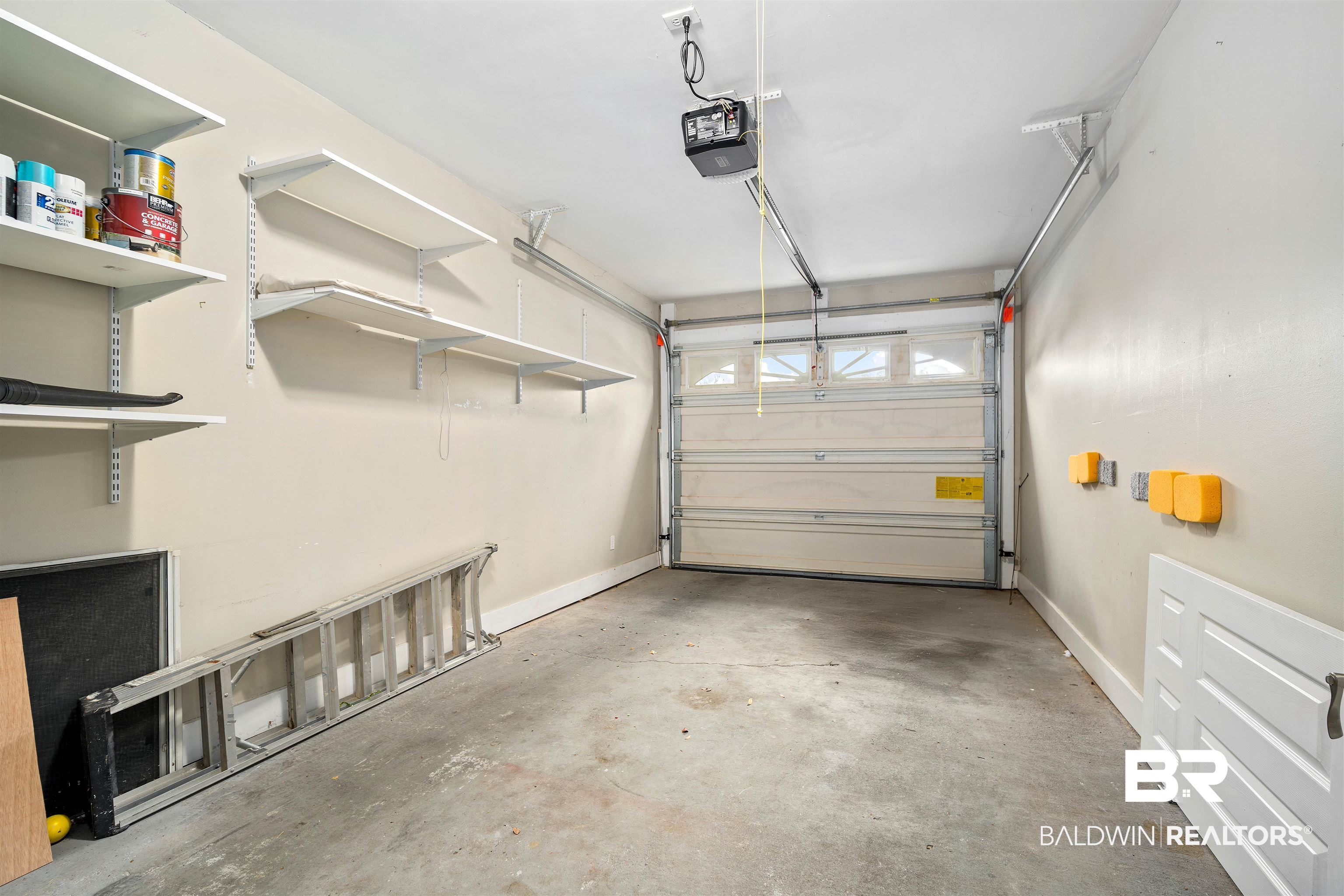 628 Spring Lake Court Mobile, AL 36695 - Photo 23 of 25 Garage featuring a garage door opener