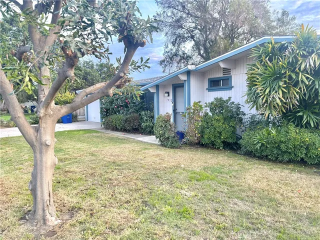 a house with trees in front of it