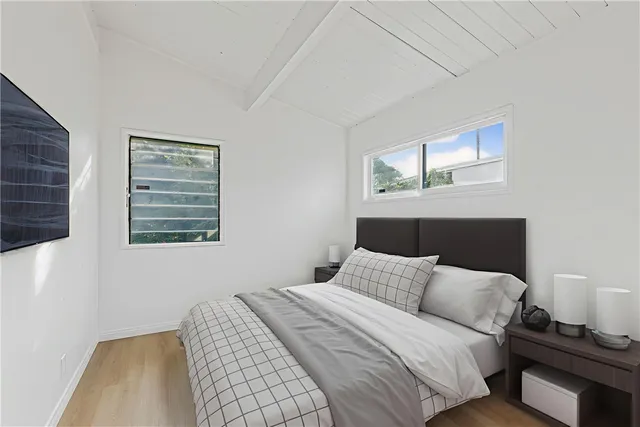 a bedroom with a bed and night stand