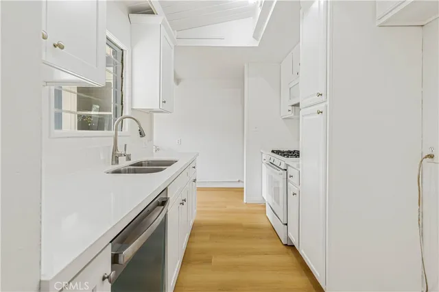 a bathroom with a sink a mirror and a bathtub