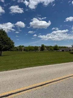 a view of a lake with a big yard
