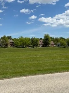 a view of a lake with a big yard