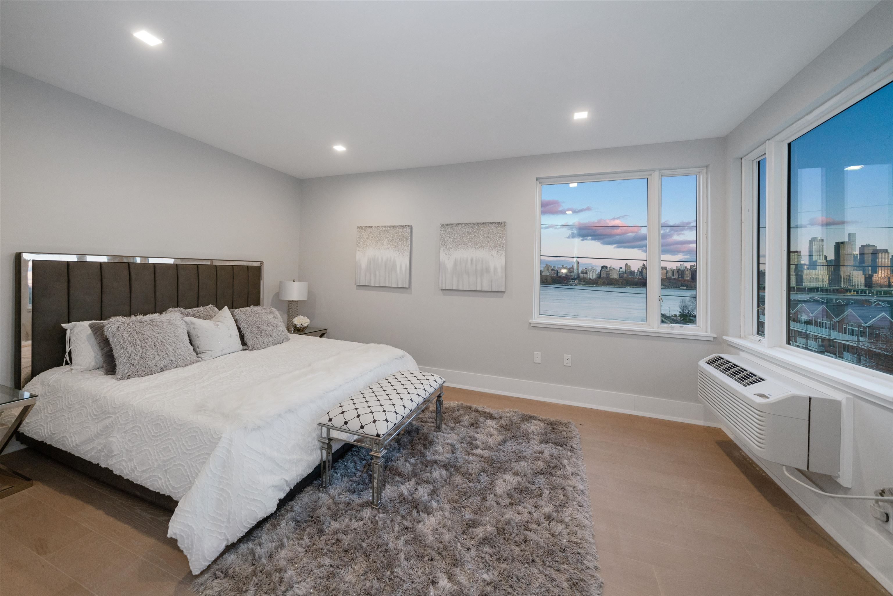 7101 River Road, Unit 202B North Bergen, NJ 07047 - Photo 12 of 26 a spacious bedroom with a bed and a large window