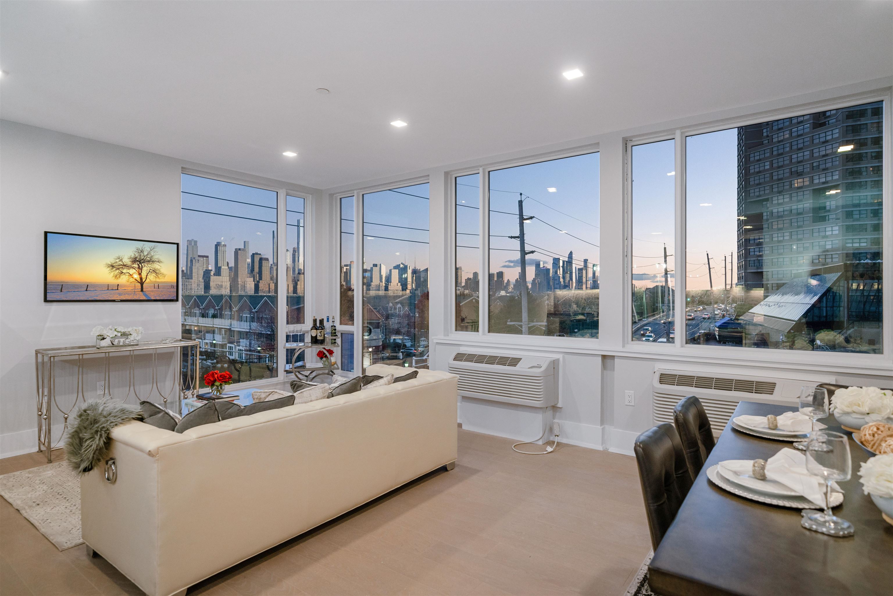 7101 River Road, Unit 202B North Bergen, NJ 07047 - Photo 3 of 26 a living room with furniture and a flat screen tv