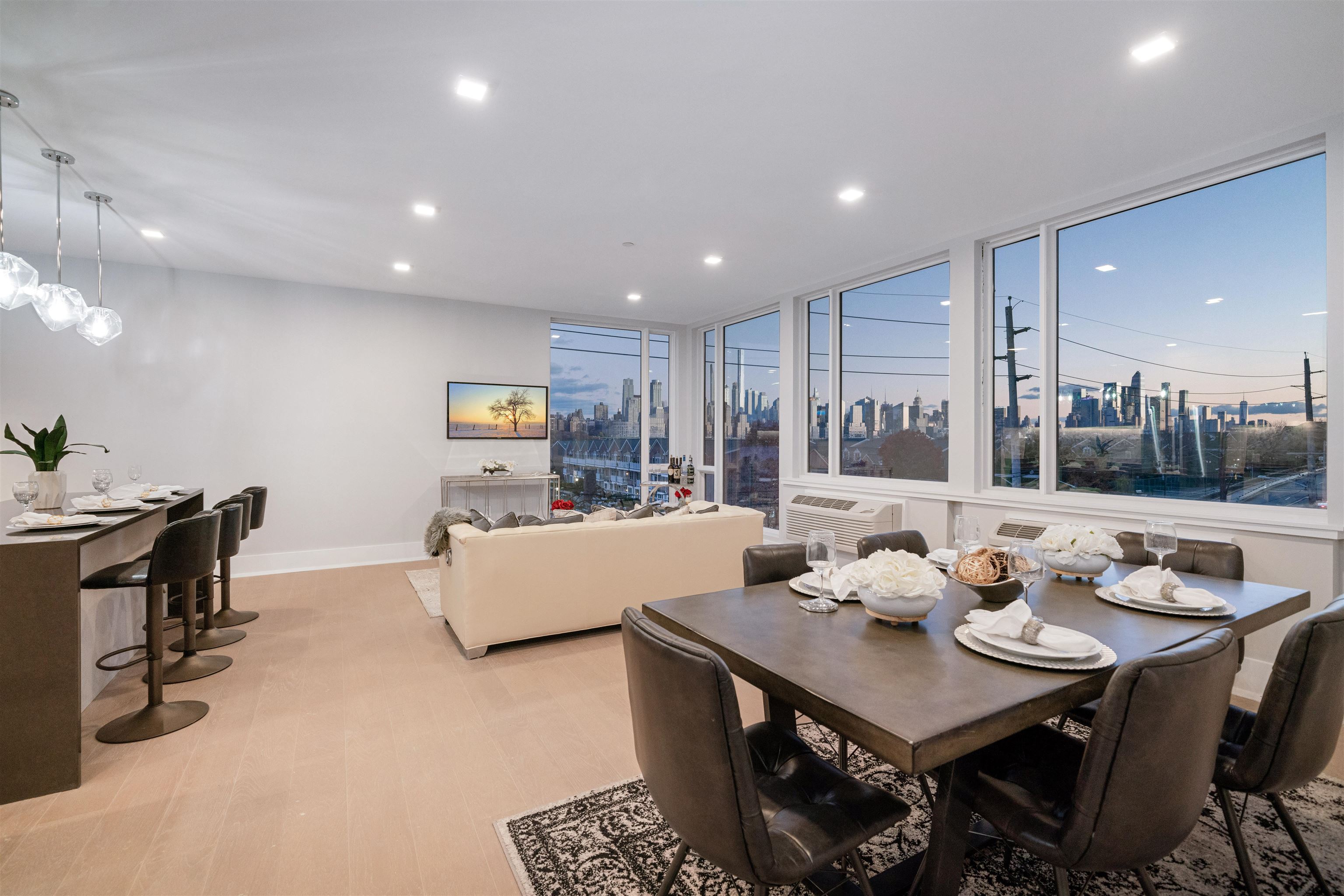 7101 River Road, Unit 202B North Bergen, NJ 07047 - Photo 5 of 26 a living room with furniture and a table