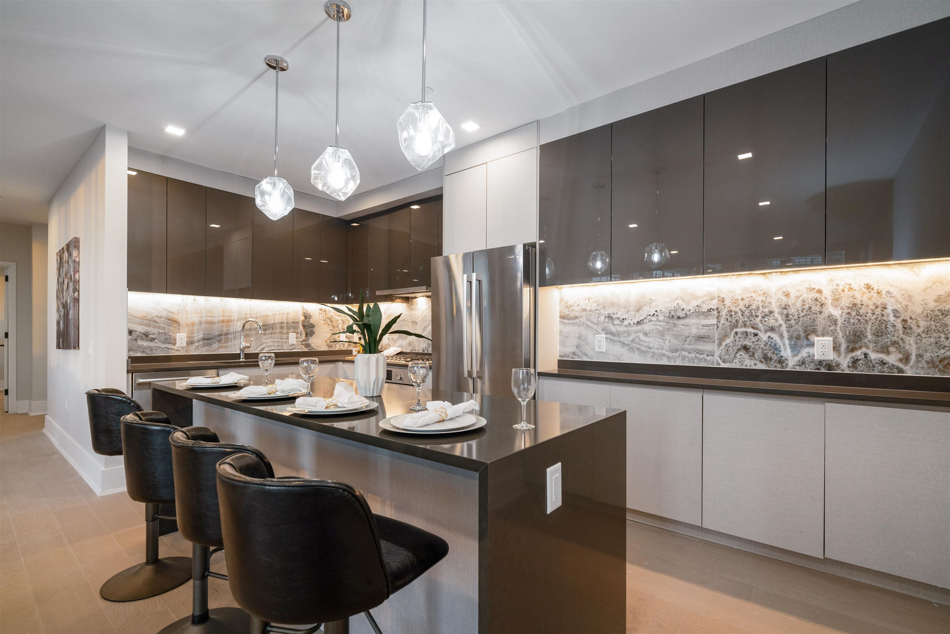 7101 River Road, Unit 202B North Bergen, NJ 07047 - Photo 6 of 26 a kitchen with stainless steel appliances granite countertop wooden cabinets a stove a sink and a refrigerator