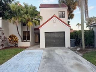 7473 Champagne Place Boca Raton, FL 33433 - Photo 1 of 27 a front view of a house with a yard and garage