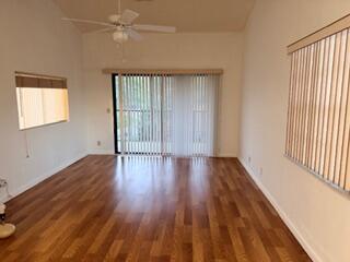 7473 Champagne Place Boca Raton, FL 33433 - Photo 17 of 27 wooden floor in an empty room with a window