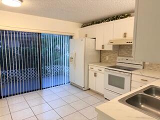 7473 Champagne Place Boca Raton, FL 33433 - Photo 3 of 27 a kitchen with a sink cabinets and appliances
