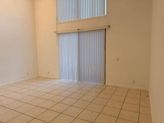 7473 Champagne Place Boca Raton, FL 33433 - Photo 8 of 27 a view of an empty room and wooden floor