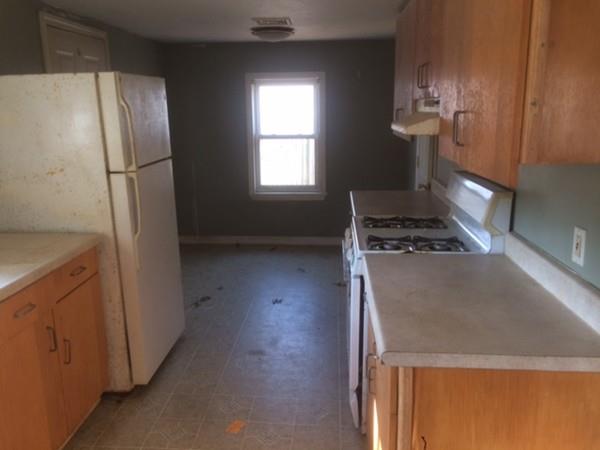 18 Salt Works Road Wareham, MA 02532 - Photo 8 of 11 a kitchen with a refrigerator and a stove