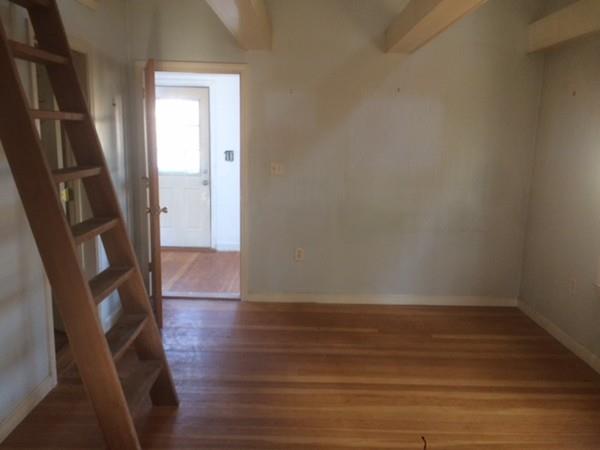 18 Salt Works Road Wareham, MA 02532 - Photo 9 of 11 a view of an empty room with wooden floor and a window