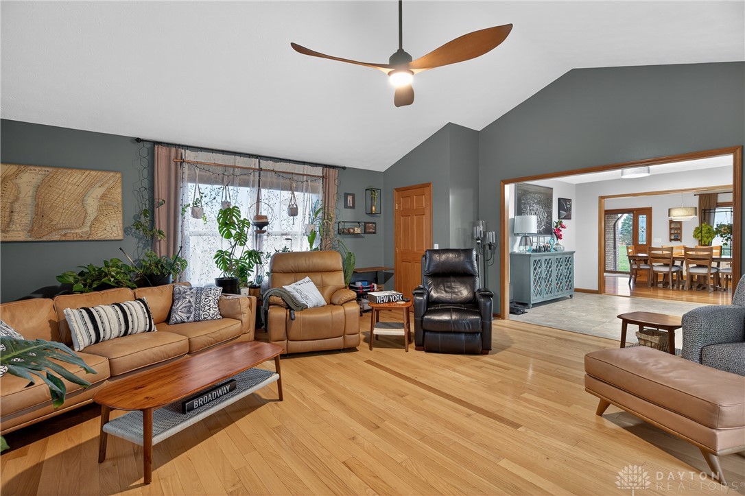 5264 Frazier-Guy Road Sidney, OH 45365 - Photo 19 of 51 This inviting living space features warm hardwood floors and a vaulted ceiling.