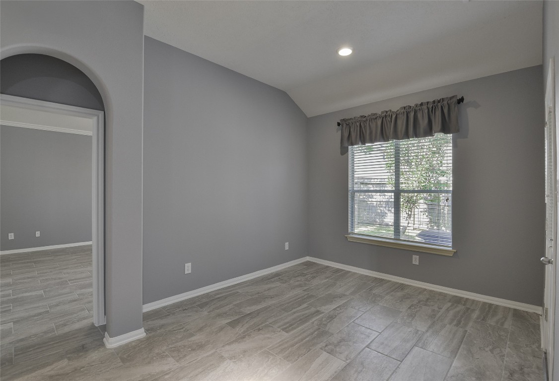 18411 Atasca Wds Trace Humble, TX 77346 - Photo 20 of 44 an empty room with wooden floor and windows