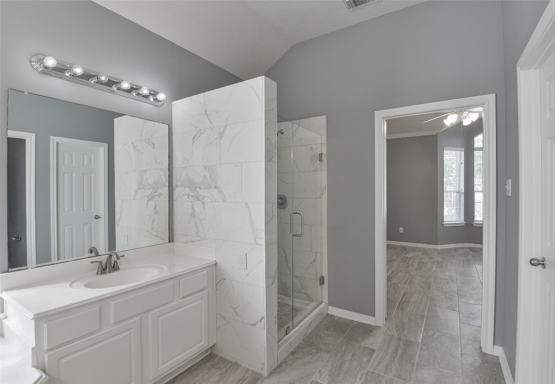 18411 Atasca Wds Trace Humble, TX 77346 - Photo 25 of 44 a bathroom with a double vanity sink mirror and shower