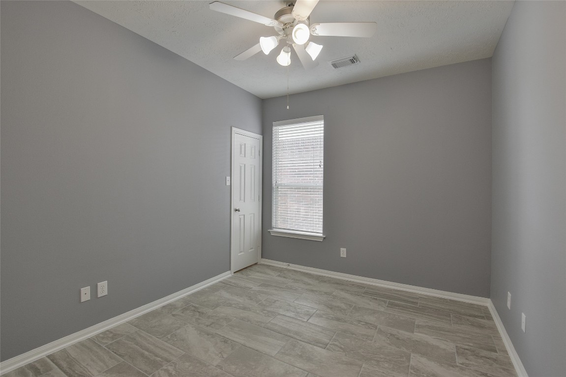 18411 Atasca Wds Trace Humble, TX 77346 - Photo 33 of 44 wooden floor in an empty room with a window
