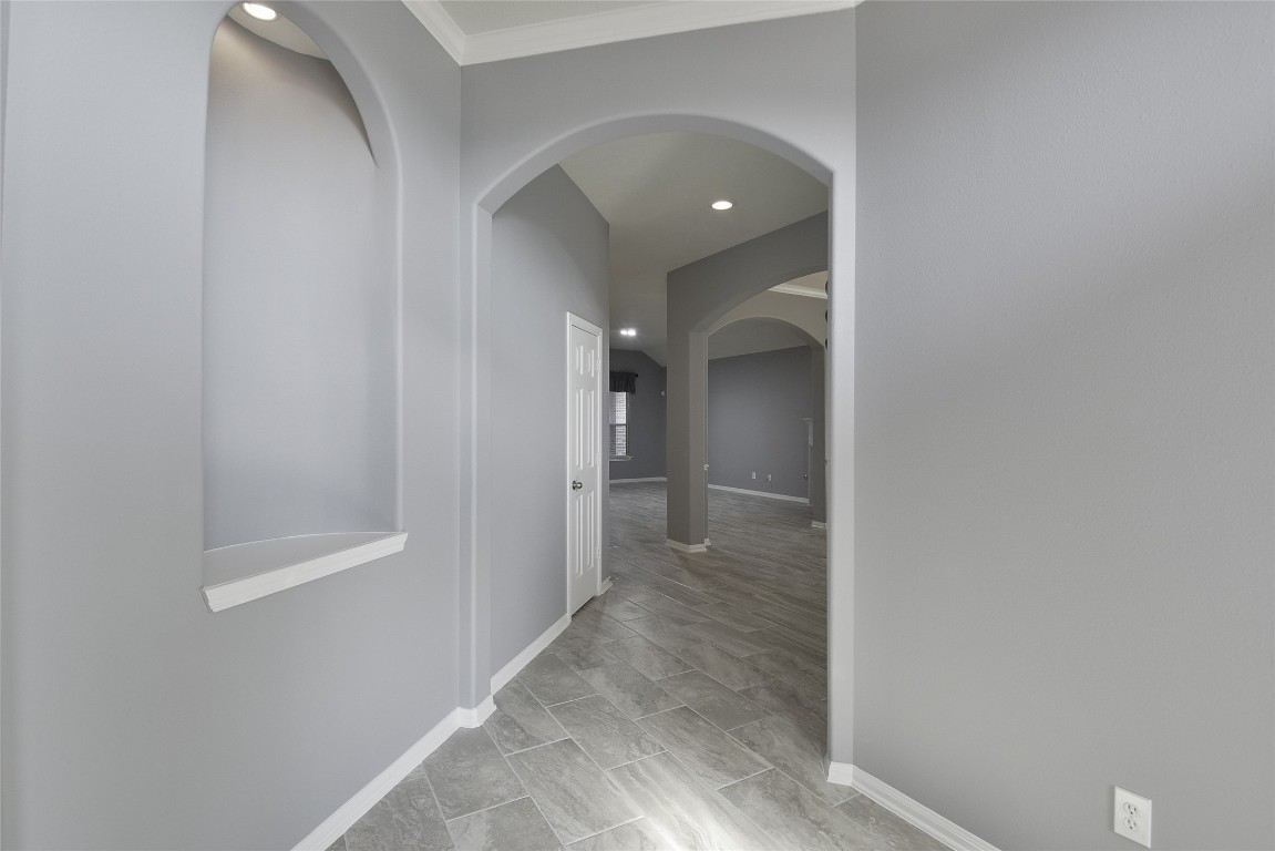18411 Atasca Wds Trace Humble, TX 77346 - Photo 6 of 44 a view of a hallway with wooden shelves