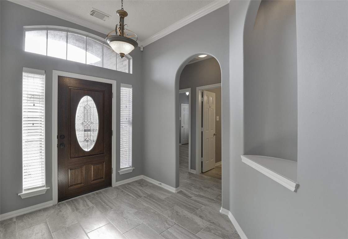 18411 Atasca Wds Trace Humble, TX 77346 - Photo 7 of 44 a view of a hallway with entryway wooden floor and front door
