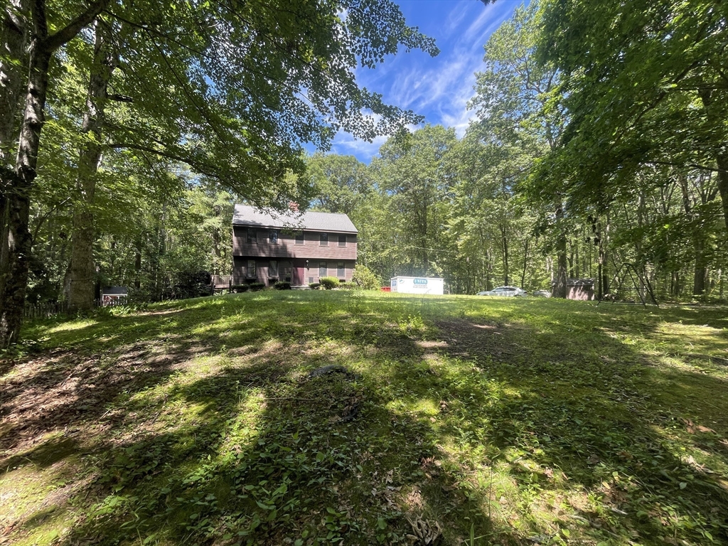 a view of a house with a big yard