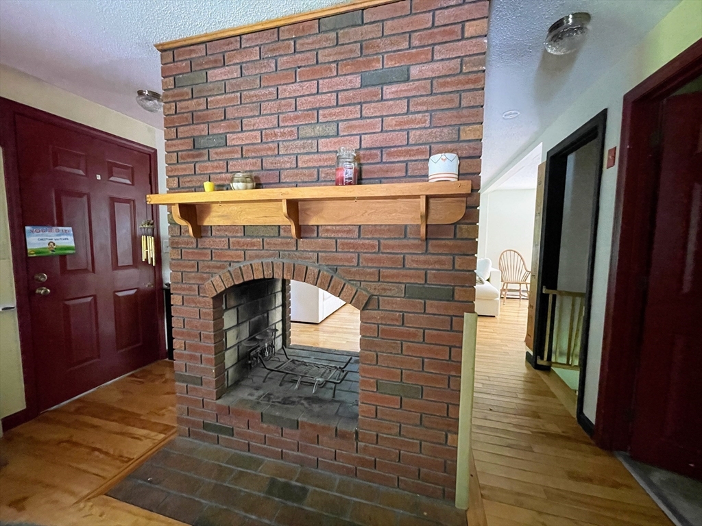 330 Arbor Street Lunenburg, MA 01462 - Photo 12 of 33 a living room with a fireplace