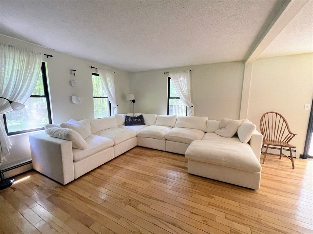 330 Arbor Street Lunenburg, MA 01462 - Photo 13 of 33 a living room with furniture and a wooden floor