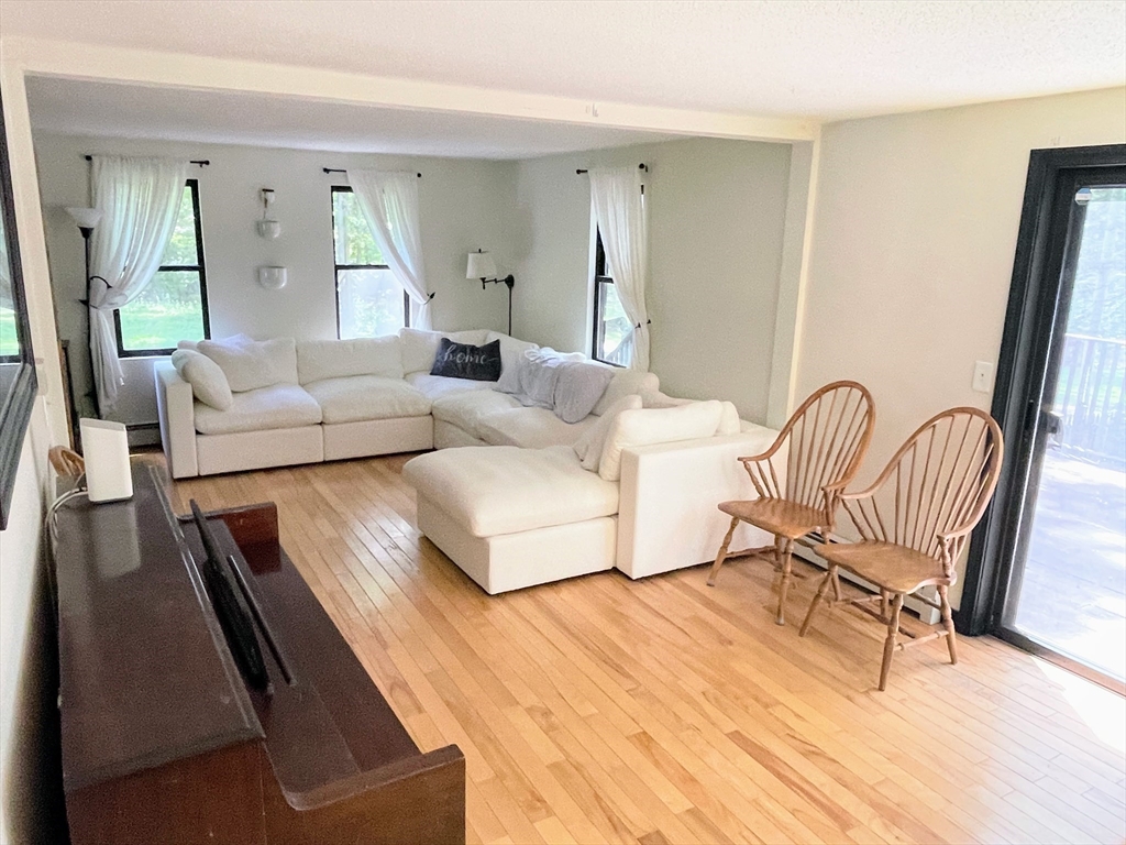 330 Arbor Street Lunenburg, MA 01462 - Photo 15 of 33 a living room with furniture and a wooden floor