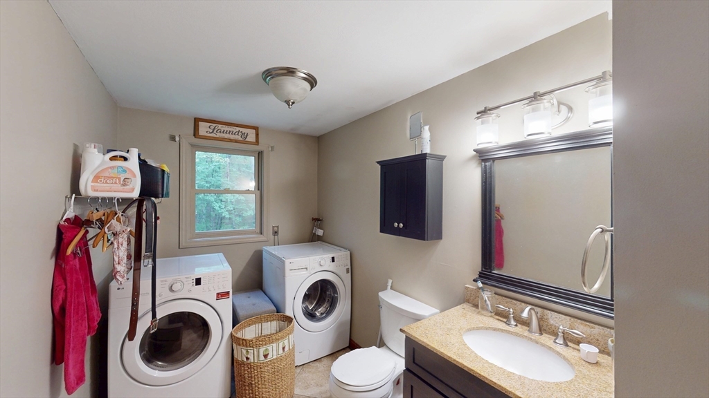 330 Arbor Street Lunenburg, MA 01462 - Photo 17 of 33 a bathroom with a sink a washer and dryer