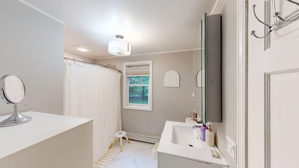 330 Arbor Street Lunenburg, MA 01462 - Photo 22 of 33 a bathroom with a sink toilet and a mirror