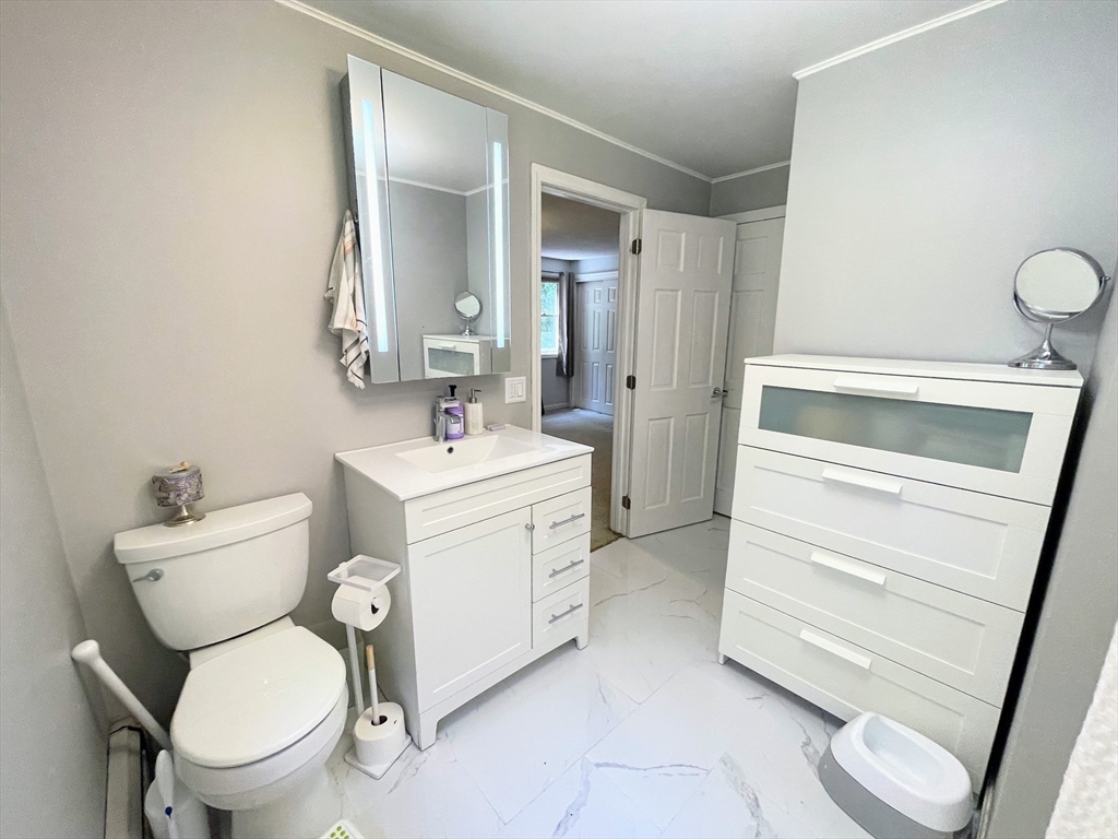 330 Arbor Street Lunenburg, MA 01462 - Photo 23 of 33 a bathroom with a toilet sink and mirror