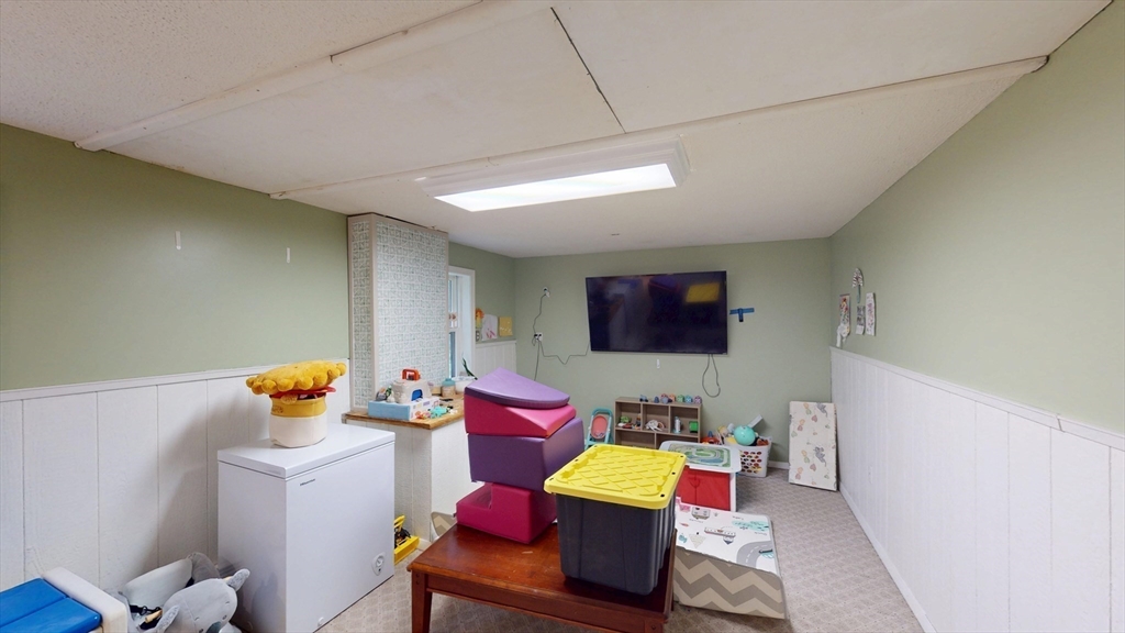 330 Arbor Street Lunenburg, MA 01462 - Photo 28 of 33 a room with furniture and a flat screen tv
