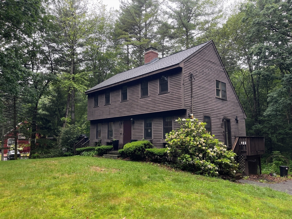 330 Arbor Street Lunenburg, MA 01462 - Photo 4 of 33 a front view of a house with garden