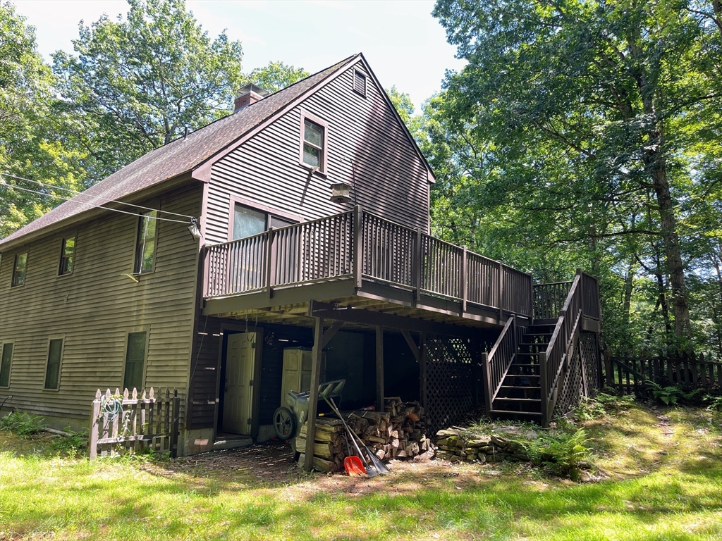 330 Arbor Street Lunenburg, MA 01462 - Photo 5 of 33 a view of a house with backyard and furniture