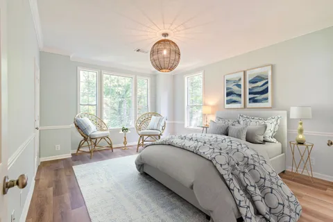 a bathroom with a sink a large mirror and a bathtub