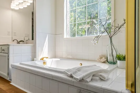a bathroom with a toilet sink and a mirror