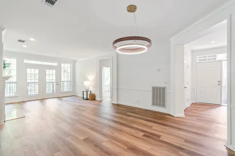 a view of a livingroom with a fireplace and window