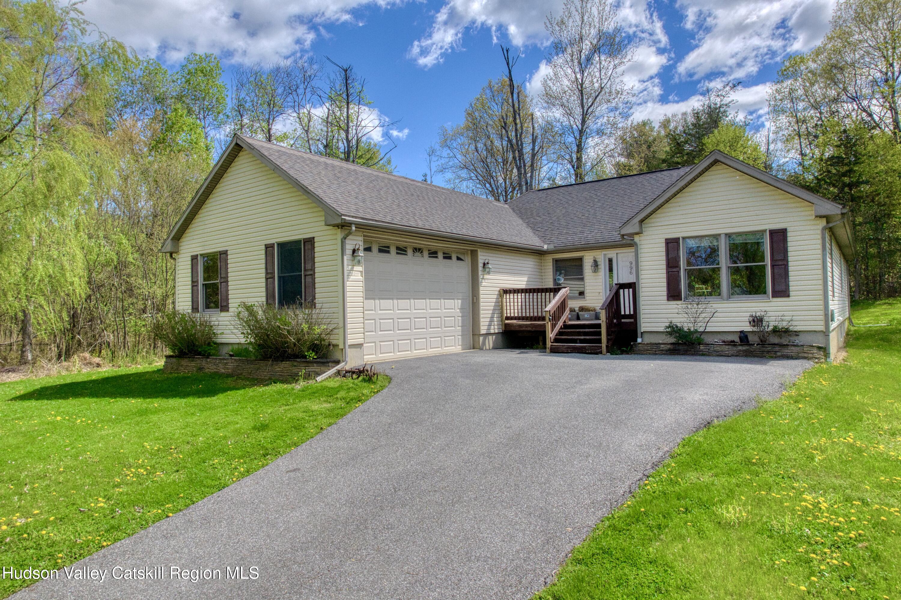 996 Sleepy Hollow Road Athens, NY 12015 - Photo 1 of 32 a view of a house with yard and a garden
