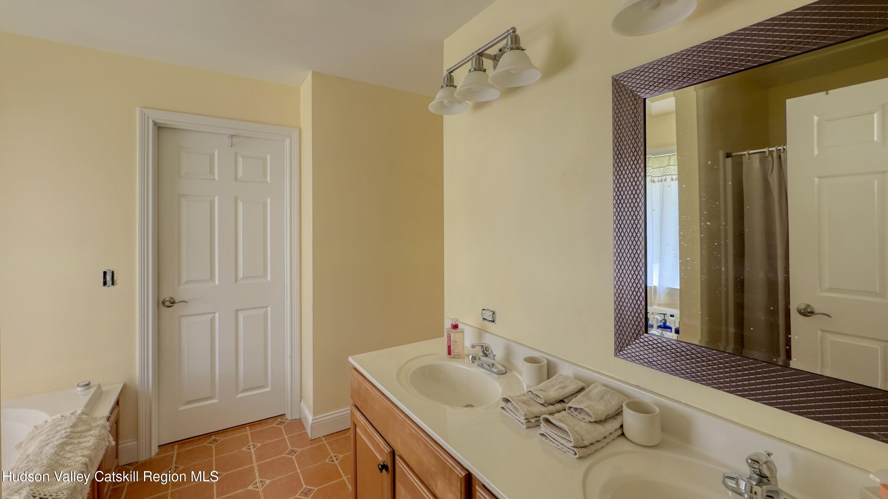 996 Sleepy Hollow Road Athens, NY 12015 - Photo 12 of 32 a bathroom with a sink and a mirror